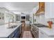 Well-equipped kitchen featuring a large island, stainless steel appliances, and open layout to the living room at 1100 Lady Slipper Way, Canton, GA 30115