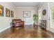 Cozy living room with hardwood floors, a brown leather loveseat, and doors to the outside at 1100 Lady Slipper Way, Canton, GA 30115