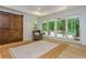 Sun Room with a wooden barn door, direct views and access to the backyard pool and patio at 1100 Lady Slipper Way, Canton, GA 30115