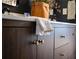 Close up of the bathroom vanity, highlighting the dark wood cabinets with stylish gold handles and clean white counter top at 1320 Country Acres Ln, Lawrenceville, GA 30045