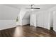 Inviting bedroom with wood floors, a window, a closet, and three white doors at 1320 Country Acres Ln, Lawrenceville, GA 30045