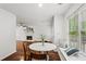 Bright dining area featuring hardwood floors and built in window seat at 1320 Country Acres Ln, Lawrenceville, GA 30045