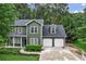 Charming two-story home featuring a 2-car garage and a manicured front yard at 1320 Country Acres Ln, Lawrenceville, GA 30045