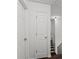 Hallway featuring multiple doors and a staircase at 1320 Country Acres Ln, Lawrenceville, GA 30045