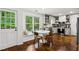 Bright kitchen with white cabinets, stainless steel appliances, and a charming breakfast nook with a window seat at 1320 Country Acres Ln, Lawrenceville, GA 30045