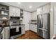 Updated kitchen with stainless steel appliances, sleek countertops, and ample cabinet space at 1320 Country Acres Ln, Lawrenceville, GA 30045