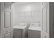 Functional laundry room with modern washer and dryer at 1320 Country Acres Ln, Lawrenceville, GA 30045