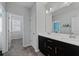 Bright bathroom with double sinks, tile floor, and neutral paint at 2100 Drew Nw Dr, Atlanta, GA 30318