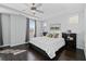Bright bedroom with tray ceilings, large windows, and a comfortable bed with stylish bedding at 2100 Drew Nw Dr, Atlanta, GA 30318