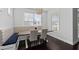 Eat-in kitchen features natural light, a long wooden table and a built-in breakfast nook at 2100 Drew Nw Dr, Atlanta, GA 30318