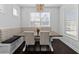 Eat-in kitchen features natural light, a long wooden table and a built-in breakfast nook at 2100 Drew Nw Dr, Atlanta, GA 30318