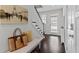 Charming entryway with decorative bench, hardwood floors, lots of natural light, and modern decor at 2100 Drew Nw Dr, Atlanta, GA 30318