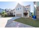 Charming two-story home featuring an attached garage and well-maintained lawn at 2100 Drew Nw Dr, Atlanta, GA 30318