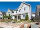 Charming two-story home boasts a quaint front porch, stone accents, and mature trees at 2100 Drew Nw Dr, Atlanta, GA 30318