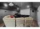 Cozy home theater room with a projector screen and comfortable seating at 2100 Drew Nw Dr, Atlanta, GA 30318