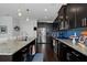 Spacious kitchen with stainless steel appliances, blue backsplash, granite countertops and dark cabinetry at 2100 Drew Nw Dr, Atlanta, GA 30318