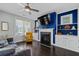 Stylish living room features a fireplace, built-in shelves, and plenty of natural light at 2100 Drew Nw Dr, Atlanta, GA 30318