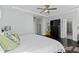 Spacious primary bedroom featuring tray ceilings, a ceiling fan, and an ensuite bathroom at 2100 Drew Nw Dr, Atlanta, GA 30318