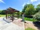 Relaxing outdoor area with a pergola, benches, and tranquil pond that offers a peaceful setting at 2100 Drew Nw Dr, Atlanta, GA 30318