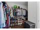 Organized walk-in closet with ample storage space for clothing, accessories, and books at 2100 Drew Nw Dr, Atlanta, GA 30318