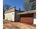 Commercial building featuring metal siding and red brick addition at 2526 Panola Rd, Lithonia, GA 30058