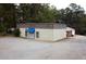 Commercial building featuring metal siding, and asphalt parking at 2526 Panola Rd, Lithonia, GA 30058
