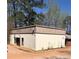 Commercial building featuring metal siding and single door entry at 2526 Panola Rd, Lithonia, GA 30058
