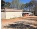 Commercial building featuring metal siding and a red brick addition at 2526 Panola Rd, Lithonia, GA 30058