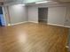 Spacious living room features wood-look flooring and neutral paint, ready for personalization and comfort at 2526 Panola Rd, Lithonia, GA 30058