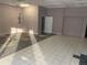 A large room with tile flooring and neutral paint ready for personalization at 2526 Panola Rd, Lithonia, GA 30058