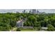 Scenic view of the Atlanta skyline surrounded by lush greenery and neighborhood homes at 339 Skylar Se Way, Atlanta, GA 30315