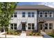 Charming townhome with neutral siding, brick accents, well-manicured landscaping, and dark door frames at 339 Skylar Se Way, Atlanta, GA 30315