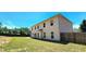 Spacious backyard with a well-maintained lawn, wood fence, and the back of the home at 5010 Lynnonhall Ct, Stonecrest, GA 30038