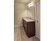 Contemporary bathroom vanity with granite countertops, tile floor and framed mirror at 5010 Lynnonhall Ct, Stonecrest, GA 30038