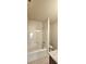 Bright bathroom featuring a bathtub with shower and granite countertop at 5010 Lynnonhall Ct, Stonecrest, GA 30038
