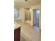 Bright bathroom featuring tile floors, walk-in shower, and a large soaking tub at 5010 Lynnonhall Ct, Stonecrest, GA 30038
