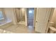 Bathroom with a soaking tub, tile flooring, and glass-enclosed shower at 5010 Lynnonhall Ct, Stonecrest, GA 30038