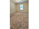 Spacious bedroom featuring a large window and neutral carpet at 5010 Lynnonhall Ct, Stonecrest, GA 30038