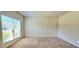 Bedroom with large windows providing abundant natural light and plush carpet flooring at 5010 Lynnonhall Ct, Stonecrest, GA 30038