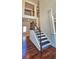 The foyer includes hardwood floors, stairs with wood and wrought iron railings, and neutral paint at 5010 Lynnonhall Ct, Stonecrest, GA 30038