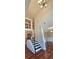 Spacious foyer with hardwood floors, a decorative chandelier, and a staircase leading to the second floor at 5010 Lynnonhall Ct, Stonecrest, GA 30038