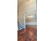 The home's foyer features hardwood floors, neutral paint, a staircase and dining room access at 5010 Lynnonhall Ct, Stonecrest, GA 30038