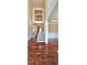 The home's foyer features hardwood floors, neutral paint, a staircase and dining room access at 5010 Lynnonhall Ct, Stonecrest, GA 30038