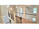 The home features an upstairs hallway with wood and wrought iron railings and neutral paint at 5010 Lynnonhall Ct, Stonecrest, GA 30038
