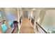 The home features an upstairs hallway with wood and wrought iron railings and neutral paint at 5010 Lynnonhall Ct, Stonecrest, GA 30038