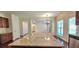 Open-concept kitchen featuring a granite island, stainless appliances, and hardwood floors at 5010 Lynnonhall Ct, Stonecrest, GA 30038