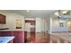 Spacious kitchen featuring hardwood floors, granite countertops, and an open design for easy entertaining at 5010 Lynnonhall Ct, Stonecrest, GA 30038