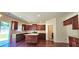 An open kitchen featuring wooden cabinets, an island, and stainless steel appliances at 5010 Lynnonhall Ct, Stonecrest, GA 30038