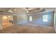 Spacious main bedroom with a tray ceiling and carpet flooring at 5010 Lynnonhall Ct, Stonecrest, GA 30038
