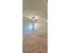 Spacious bedroom featuring a tray ceiling, ceiling fan, and carpet flooring at 5010 Lynnonhall Ct, Stonecrest, GA 30038